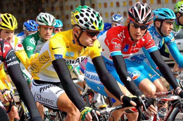 Race leader Floyd Landis (Phonak - iShares) chats with number 5 in the overall rankings Frank Schleck (Team CSC). Photo copyright Fotoreporter Sirotti.