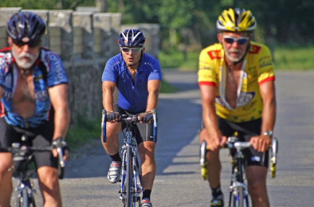 Seasoned riders start to zip down as they begin to heat up at on lower apron of climb.