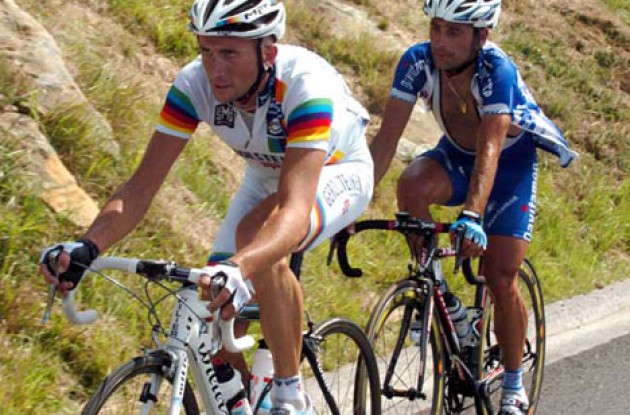 Davide Rebellin and Paolo Bettini working hard on the last climb. Photo copyright Fotoreporter Sirotti.