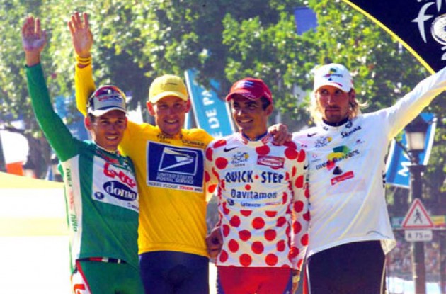 The four jersey winners on the podium in Paris. From left to right: Robbie McEwen (best sprinter), Lance Armstrong (Tour winner), Richard Virenque (best climber), and Vladimir Karpets (best young rider).