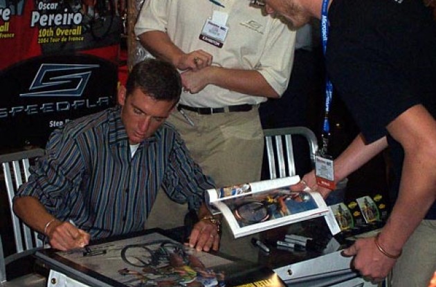 Tyler Hamilton signs autographs at the Speedplay booth. Photo copyright Roadcycling.com.