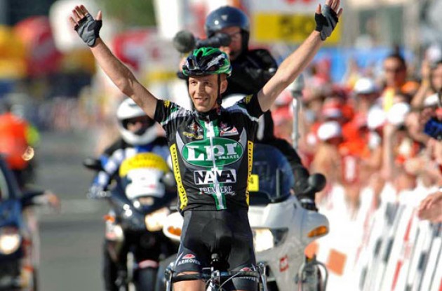 Contrini takes the stage win after a long solo ride. Photo copyright Fotoreporter Sirotti.
