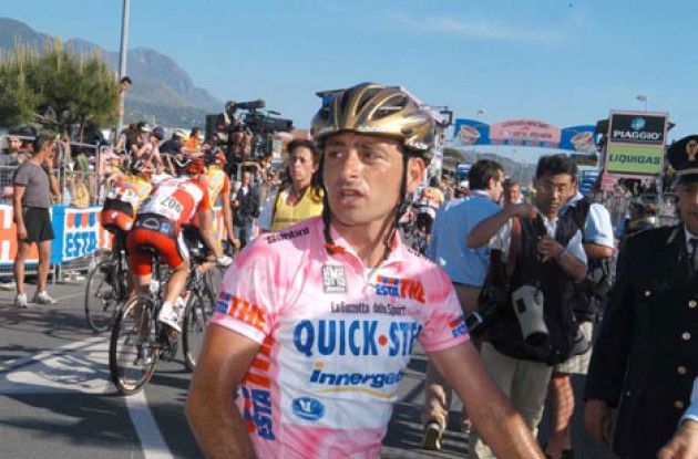 Bettini lost the Maglia Rosa today - but will keep his golden helmet. Photo copyright Fotoreporter Sirotti.