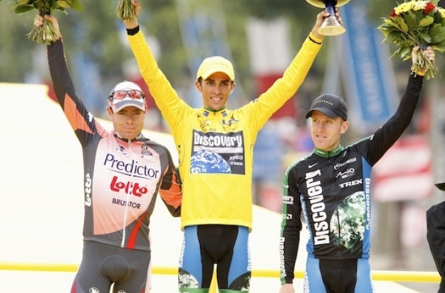 Top 3 on the podium in Paris: Contador, Evans, and Leipheimer. Photo copyright <A HREF="http://www.photoshelter.com/usr-show?U_ID=U0000yEwV90OAoAE" TARGET="_BLANK">www.BenRossPhotography.com</A>.