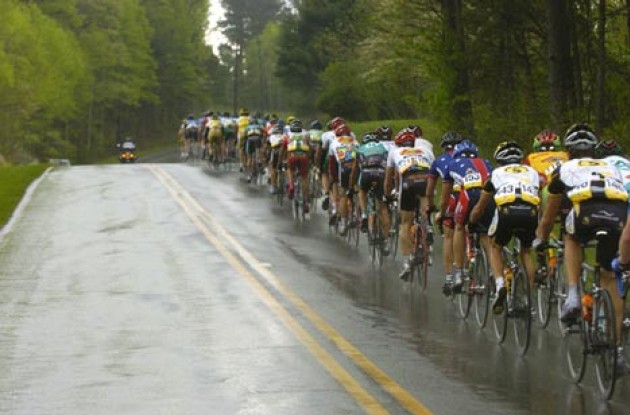 The peloton chases the break during the major downpour of the day. Photo copyright Casey Gibson.