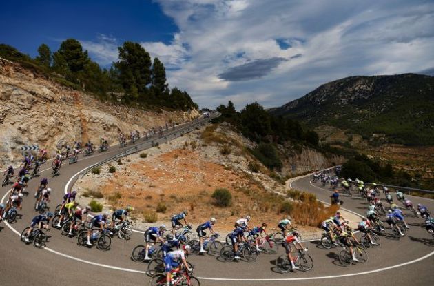 Cycling peloton cornering in spanish mountains