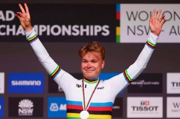 Tobias Foss wearing the World Champion rainbow jersey on the podium