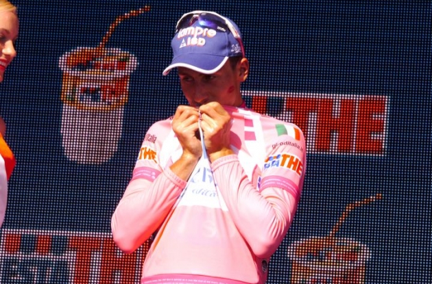 Adriano Malori is the Giro d'Italia's new maglia rosa. One of the podium girls left her signature on his cheek. Photo Fotoreporter Sirotti.