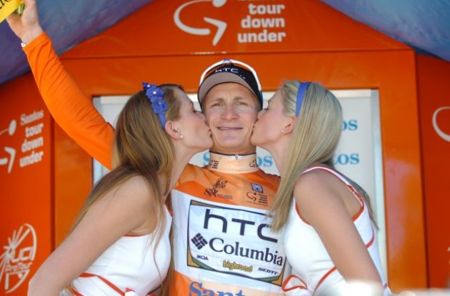 Andre Greipel on the podium getting sweet kisses from the beautiful podium girls. Photo copyright Fotoreporter Sirotti.