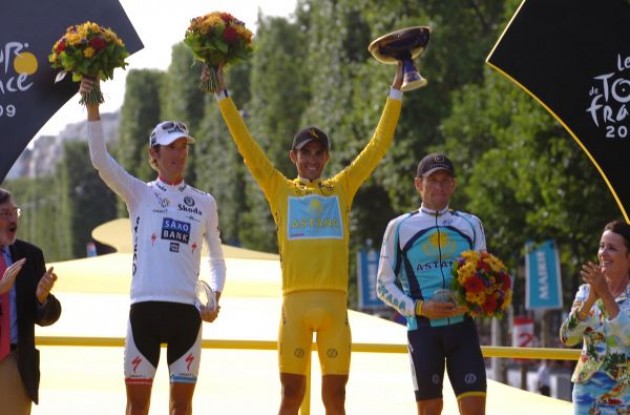 The top 3 on the podium. Alberto Contador (Team Astana), Andy Schleck (Team Saxo bank) and last but definitely not least Lance Armstrong (Team Astana). Photo copyright Fotoreporter Sirotti.