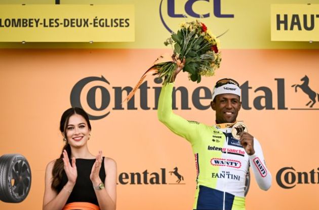 Biniam Girmay on the stage winner podium after stage 8 of Tour de France 2024