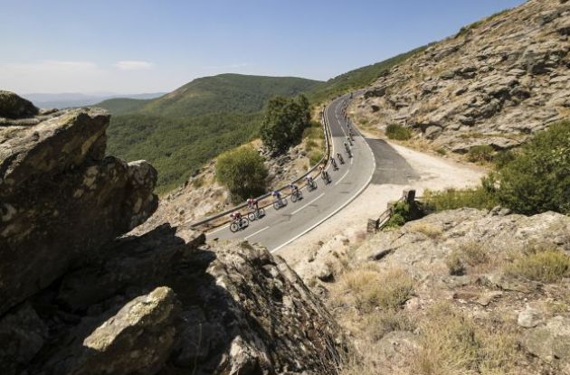 Cyclists on curved road in Vuelta a Espana