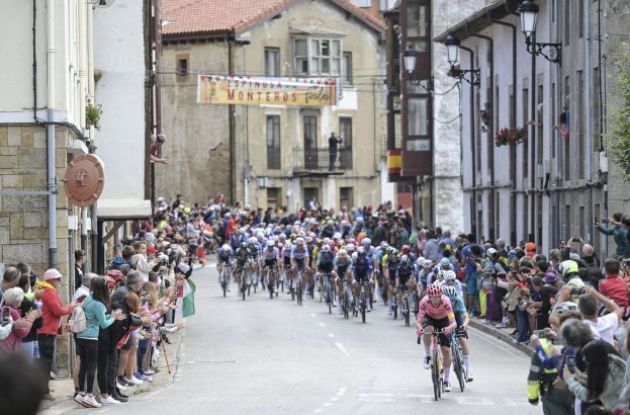 Cycling peloton in Spanish village at La Vuelta