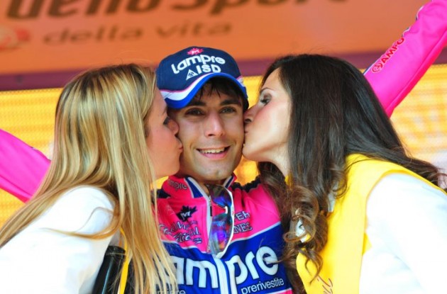Diego Ulissi gets celebrated by the podium girls.