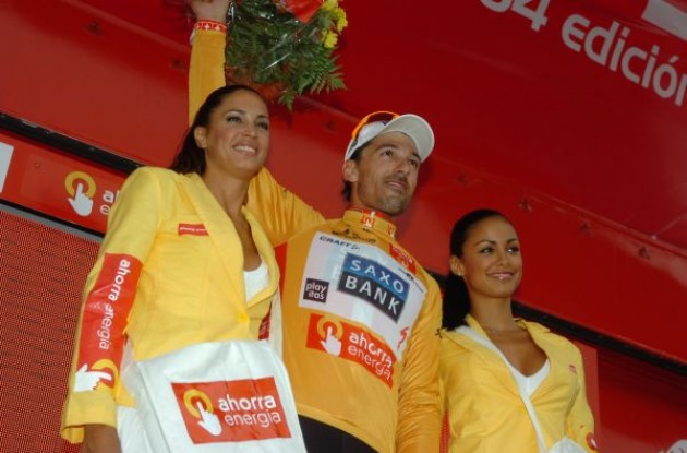 Fabian Cancellara on the podium with the well-equipped Spanish podium girls. Photo copyright Fotoreporter Sirotti.