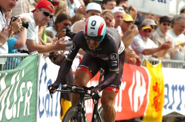 Fabian Cancellara powers to individual prologue victory in 2012 Tour de France for Team RadioShack-

Nissan ahead of Team Sky Procycling's Bradley Wiggins and Sylvain Chavanel of Team Omega Pharma-

QuickStep. Photo Fotoreporter Sirotti.