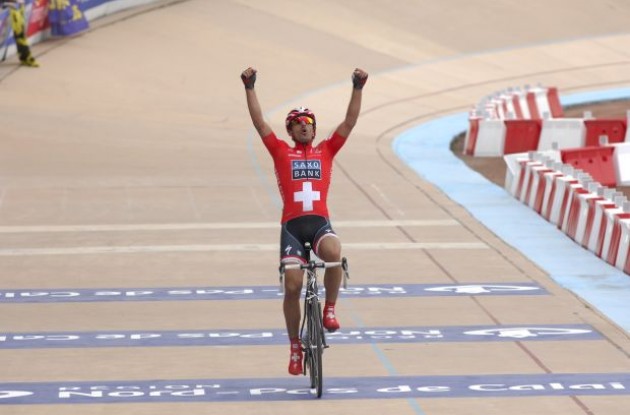 Team Saxo Bank's Fabian Cancellara wins the 2010 Paris-Roubaix. Photo copyright Fotoreporter Sirotti.
