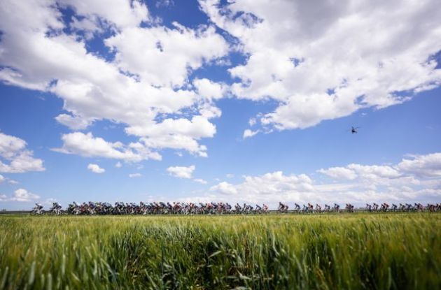 Giro d'Italia cyclists riding through Italian landscape