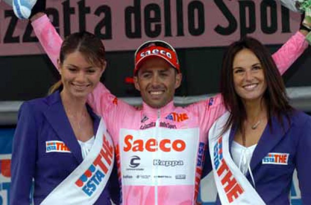 Look who's smiling now. Simoni looking set to win this year's edition of the highly contested competition for most days with the Giro podium girls. Photo copyright Fotoreporter Sirotti.