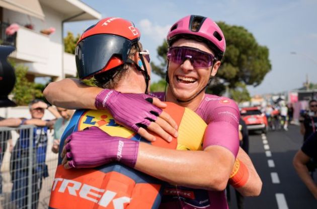 Jonathan Milan smilingly hugs teammate from Lidl-Trek