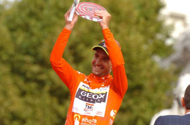 Juan Jose Cobo Acebo with the winner's trophy on the podium in Madrid, Spain. Photo Fotoreporter Sirotti.