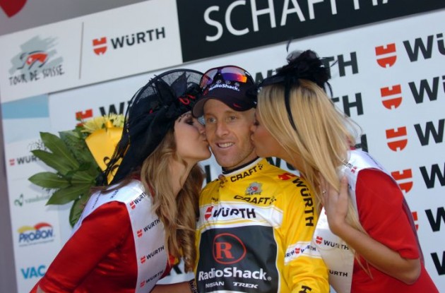 Team RadioShack's Levi Leipheimer celebrates his 2011 Tour de Suisse victory on the podium with the Swiss podium babes. Photo Fotoreporter Sirotti.