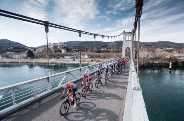 Paris-Nice peloton crosses bridge during stage 5