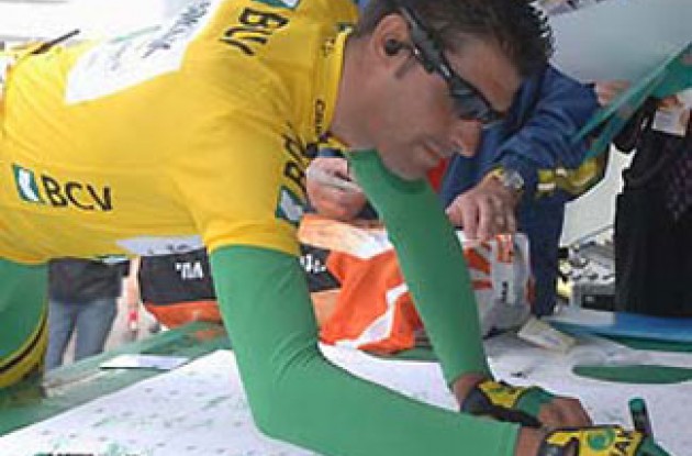 Oscar Pereiro signs in. Photo copyright Roadcycling.com.