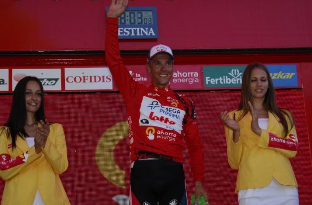 Philippe Gilbert celebrates his Vuelta lead on the podium with the beautiful Spanish podium girls. Photo copyright Fotoreporter Sirotti.