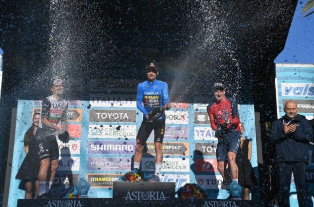 Primoz Roglic, Joao Almeida and Tao Geoghegan Hart celebrating with champagne on the podium