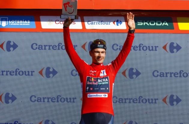 Primoz Roglic on the Vuelta a Espana podium in the red jersey