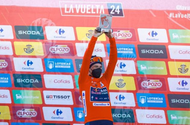 Primoz Roglic on the podium in the red jersey at La Vuelta