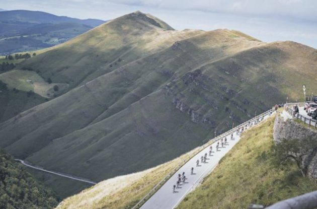 Professional cyclists in mountains during stage 20 of Vuelta a Espana 2024