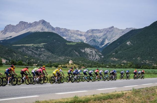 Tour de France cyclists passing by French mountains