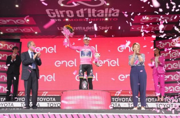 Remco Evenepoel is celebrated on the podium as leader of Giro d'Italia 2023