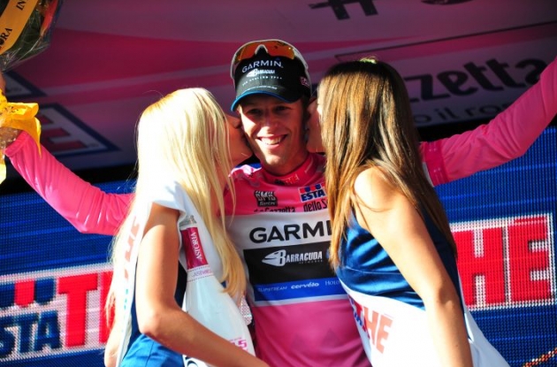 Team Garmin-Barracuda's Canadian Ryder Hesjedal scores overall Giro d'Italia lead and secures a bonus from the Italian podium babes. Photo Fotoreporter Sirotti.