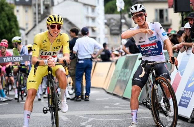 Tadej Pogacar laughing with Remco Evenepoel