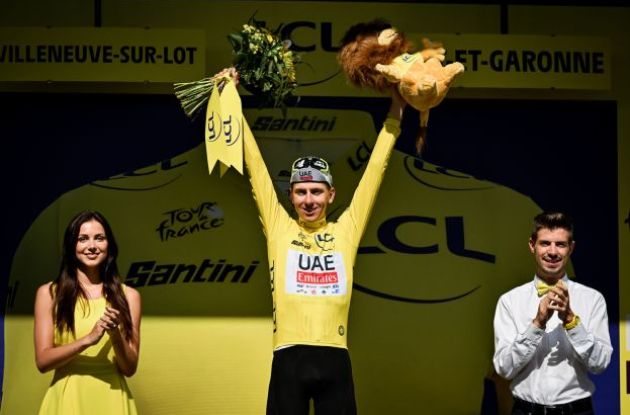 Tadej Pogacar on the Tour de France podium in the yellow jersey