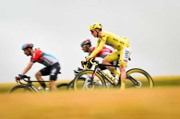 Tadej Pogacar riding on his yellow Colnago bike