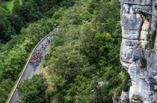 Tour de France cyclists riding though mountain territory