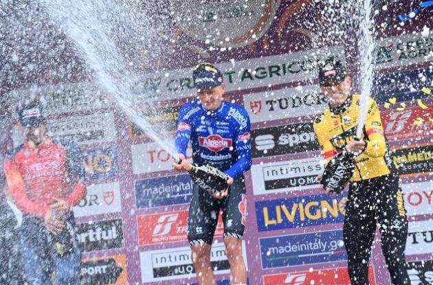 Mathieu van der Poel, Filippo Ganna and Wout van Aert celebrating with champagne on the podium
