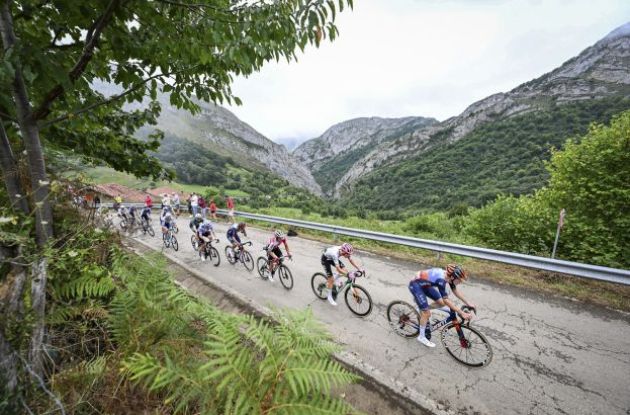 Cyclists riding through Lagos de Covadonga during Vuelta a Espana