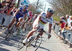 Bettini climbs closely followed by Boonen.