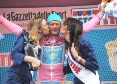 Vinokourov is in good company on the podium. What's a bit of rain and mud when you've got ... Photo copyright Fotoreporter Sirotti.