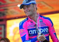 A proud Alessandro Petacchi celebrates his stage win on the Giro podium. Photo Fotoreporter Sirotti.