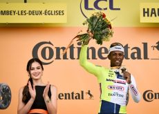 Biniam Girmay on the stage winner podium after stage 8 of Tour de France 2024