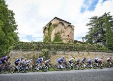 Cyclists next to historic architecture in Rioja