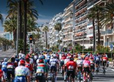 Cyclists riding through Nice in stage 8 of Paris-Nice
