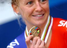Great Britain's charming and powerful Emma Pooley proudly shows her bronze medal to the press in Copenhagen, Denmark. Photo Fotoreporter Sirotti.