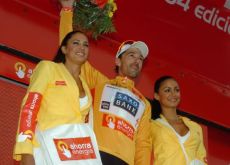 Fabian Cancellara on the podium with the nicely tanned podium girls. Photo copyright Fotoreporter Sirotti.